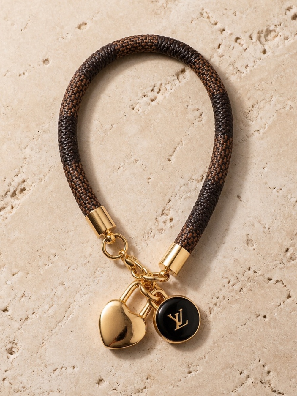 Louis Vuitton Brown Leather Bracelet with Gold Charms and Black Enamel LV charm.